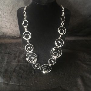 Silver circle like necklace.